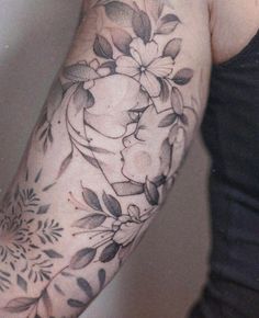 a person with a flower tattoo on their arm