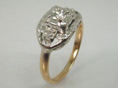 Up for sale is unique diamond engagement ring with estimated circa 1940s era styling. It's crafted in 2.6 grams of 18K yellow gold (shank, tested) with 14k white gold top (tested). It's stamped 18K inside the shank, as well as R.J.CO. The center stone is an Old European cut diamond measuring 4 mm x 2.4 mm deep and weighing an estimated 0.24 carats. It's a fiery stone that looks super, a nicely cut and quality (H-SI1) diamond. It's flanked by 2 single cut diamonds (H-SI1 on average) they weigh an Vintage Yellow Gold Diamond Ring For Formal Occasions, Vintage Yellow Gold Diamond Ring With Brilliant Cut, Estate Oval Diamond Cut Ring, Estate Style Oval Diamond Cut Ring, Vintage Gold Round Cluster Ring, Gold Art Deco Ring With Center Stone, Classic Collectible Cluster Ring With Diamond Cut, Vintage 14k Gold Cluster Ring Hallmarked, Classic Gold Diamond Ring Collectible