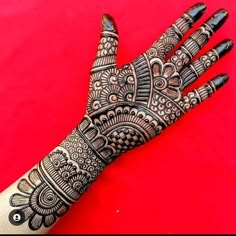 the hand is decorated with intricate designs