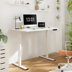 a white desk with a black clock on it