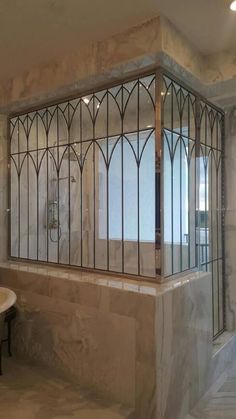 a bath room with a stand up shower next to a sink