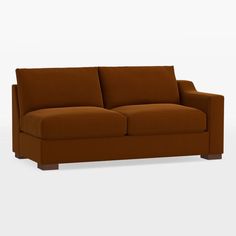 a brown couch sitting on top of a white floor