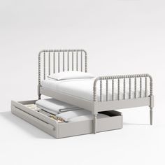 a bed with two drawers underneath it