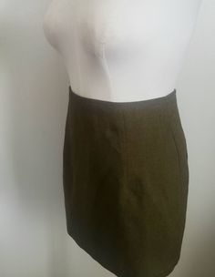 "Vintage 90s mini skirt By Odds N Ends Olive green twill Pleated back Flat front Back zip Made in USA Excellent vintage condition Tagged a size 11 Fitsblike a Medium Measured flat Across waist 15\" Across hips 19\" Across hem 21\" Length 16.5\"" 90s Mini Skirt, Olive Green, Vintage 90s, Mini Skirt, Womens Skirt, Mini Skirts, Bathing Beauties, Music Clothes, Clothes For Women