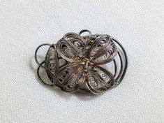 Pretty vintage silver tone flower brooch. Floral theme. C1950's. Decorative mount. Mid century. Gift idea. Tracked shipping from my vintage store, Bags Of Fun in Cyprus.  If you are outside of the EU customs charges may apply.   If you're in the EU you have the right to return this item within 14 days of arrival for a full refund. Silver Vintage Flower Brooches, Retro Silver Brooch Pin, Silver Retro Brooch Pin, Antique Silver Vintage Brooches As Gift, Silver Retro Brooches For Gift, Vintage Silver Flower Pins, Retro Silver Brooches For Anniversary, Vintage Handmade Silver Pins, Silver Retro Brooches For Anniversary