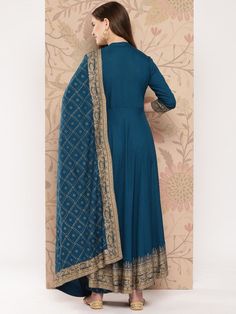 Size: please Check the last image above for a complete size chart. Blue printed Kurta with Palazzos with dupattaKurta design: Ethnic motifs printed Anarkali shape Empire style Mandarin collar, three-quarter regular sleeves Calf length length with flared hem Viscose rayon machine weave fabric Palazzos design: Printed Palazzos Elasticated waistband Slip-on closure Material & Care Kurta Fabric : RayonPalazzo Fabric : RayonDupatta : RayonHand Wash