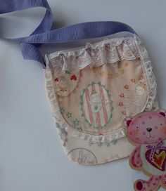 This pretty little girls bag is ideal for a 2-4 year old.  The body of the bag is fully lined with pink cotton fabric with little ballerinas. The flap of the bag is edged with a pale lilac and cream lace.  Measurements: Width 17.5 cm, length 20 cm. Orders taken for variation in size and fabric that is in stock. REDUCED PRICE FROM $20 TO $15. Cute Cream Shoulder Bag For Gifts, Cute Cream Shoulder Bag As Gift, Handmade Pink Bags For School, Handmade Pink School Bags, Handmade Cute Cotton Shoulder Bag, Cute Handmade Cotton Shoulder Bag, Handmade Cute Shoulder Bag For School, Cute Handmade Shoulder Bag For School, Pink Cotton Fabric