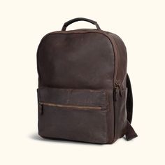 Discover the epitome of classic leather backpacks with the Walker Leather Backpack. Crafted in vintage brown oak leather, this backpack is a perfect companion for your everyday journeys. Made from premium full grain leather and interior canvas material, it combines superior quality with timeless style, ensuring durability and lasting appeal. With its easy-access external zipper pocket, this backpack offers efficient storage for your essentials. It includes a cushioned laptop sleeve, a sewn-in in Classic Leather Backpack With Smooth Grain For Everyday Use, Classic Backpack With Smooth Grain For Everyday Use, Classic Leather Backpack For On-the-go, Brown Travel Backpack With Smooth Grain, Travel Backpack With Smooth Grain In Brown, Rectangular Smooth Grain Backpack For Travel, Brown Smooth Grain Travel Backpack, Classic Leather Backpack With Smooth Grain For Travel, Classic Leather Backpack With Leather Lining For On-the-go