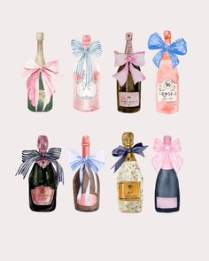 there are many different types of bottles in this picture together, each with a bow on the top