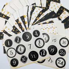 a bunch of black and white paper with numbers on them