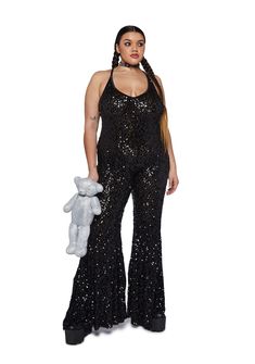 cuz you’ve got them mesmerized. This jumpsuit has a stretchy sequin construction, flare pants, an open back, and cross straps. 70s Disco Party Outfit Plus Size, Glamorous Stretch Sequin Jumpsuits And Rompers, Sequin Backless Jumpsuits And Rompers For Night Out, Sequin Backless Jumpsuits And Rompers For Party Season, Black Stretch Sequined Jumpsuits And Rompers, Black Stretch Jumpsuits And Rompers With Sequins, Sequin Jumpsuits For Costume Party, Sequined Jumpsuits For Costume Parties, Sequin Jumpsuits And Rompers For Costume Party