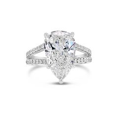 a pear shaped diamond engagement ring on a white background