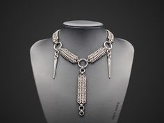 This gothic chainmail necklace called "Amon" is handmade from 304 stainless steel. It is a durable and hypoallergenic material which won't rust or tarnish over time. The clasp and spikes are also stainless steel.  Available in 3 adjustable sizes (by -1 cm /+3 cm). You can also choose the custom size option if required: select any of the standard options and specify your size in the optional field. I will only consider the latter.  I start making the necklace when you place the order. Please coun Gothic Stainless Steel Chain Necklace, Handmade Silver Gothic Chain Necklace, Gothic Silver Box Chain Necklace, Gothic Metal Chainmail Choker, Gothic Stainless Steel Chainmail Jewelry, Silver Chainmail Punk Jewelry, Gothic Chainmail Metal Jewelry, Gothic Chainmail Jewelry, Chainmail Clothing