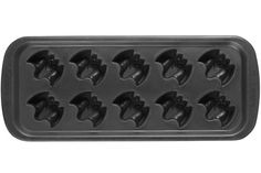 an image of a chocolate molding tray with many heads on it's side