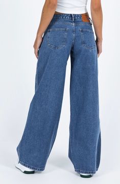 Flaunt vintage vibes in these medium-wash nonstretch jeans featuring a low-rise waist and full-length wide legs. 31 1/2" inseam; 26" leg opening; 10 1/2" front rise; 14" back rise (size 8) Zip fly with button closure Five-pocket style 70% cotton, 15% viscose, 15% polyester Machine wash, line dry Imported Wide Jeans Outfit High Waist, Medium Wash Jeans Outfit, Low Rise Wide Leg Jeans, Womens Low Rise Jeans, Ultra Low Rise Jeans, School Clothing, Church Fits, High School Outfits, Fun Clothes