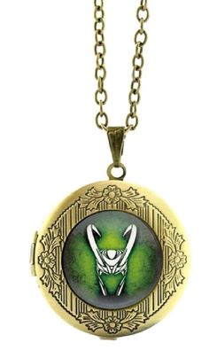 a green and gold locke necklace with an image of a man's face on it