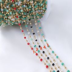 the beaded chain is being used to make necklaces