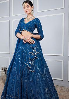 Readymade Embroidered Faux Georgette Lehenga in Blue This attire with Cotton Lining is Enhanced with Resham, Sequins and Gota Lace Work. Crafted in V Neck and Half Sleeve Available with a Faux Georgette Choli and a Faux Georgette Dupatta in Blue The Choli and Lehenga Length are 12 to 15 and 42 inches respectively Do note: Accessories shown in the image are for presentation purposes only.(Slight variation in actual color vs. image is possible). We sell all kinds of Lehenga and Chaniya Choli Casua Embellished Blue Palazzo Set For Reception, Blue Embellished Anarkali Lehenga, Designer Blue Embellished Palazzo Set, Blue Embellished Floor-length Lehenga, Blue Embellished Palazzo Set For Eid, Embellished Blue Palazzo Set For Eid, Embellished Blue Georgette Palazzo Set, Blue Embellished Lehenga For Navratri, Blue Fitted Sharara With Intricate Embroidery