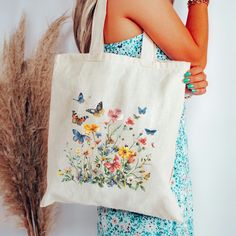 InfiniteBluskyesCo🌸 Embrace the beauty of nature with our enchanting vintage wildflower cotton canvas tote bag. This eco-friendly shopper is adorned with a delicate pressed wildflower design, capturing the timeless allure of the countryside.  This farmer market-style canvas tote 100% cotton bag comes in one size - 15" x 16"- perfect for everyday wear. This spacious tote bag will be the best companion on weekly shopping trips, walks in the dog park, and beach days. It's made from a natural, 12oz Floral Print Canvas Tote Shoulder Bag, Eco-friendly Floral Canvas Bag For Everyday Use, Spring Floral Print Canvas Bag, Daily Use Canvas Bags With Floral Print, Spring Bohemian Canvas Tote Bag, Spring Botanical Rectangular Bags, Summer Floral Print Canvas Shoulder Bag, Floral Print Rectangular Canvas Bag, Rectangular Floral Print Canvas Bag