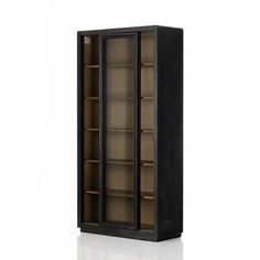 an empty bookcase with glass doors on the front and bottom shelves in dark wood