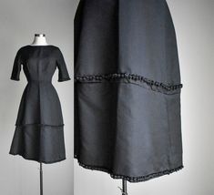 "ABOUT: Vintage late 50s early 60s black cocktail dress with super structured 2 tier skirt with tassels throughout. It features a classy scoop neckline, short sleeves and zips at the back. Dress is unlined. TAG: The Jenny Shoppe Washington DC TAG SIZE: no size FITS LIKE:XS in womens due to the 22\" waist -  see measurements below Please compare measurements to a like item in your wardrobe that already fits. MEASUREMENTS- (taken with garment laying flat in inches, not doubled) shoulder: 16\" pit Skirt With Tassels, Vintage Wrangler Jeans, Prairie Skirt, Early 60s, Formal Cocktail Dress, Black Formal, Black Cocktail, Linen Skirt, Maxi Gowns