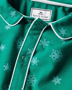 Admire wintry snowflakes without feeling any chill in the air. Flurries cover a striking emerald green flannel background, making this set a cozy hit for any holiday moment. Our Romper is made of the softest brushed lightweight, very soft flannel which will allow your little one to walk, crawl, or relax in comfort. Petite Plume debuted the first-ever chemical-free, flame-retardant fabric for children's sleepwear. Fine yarn-dyed cotton is blended with a touch of inherently flame-retardant fiber t Green Cotton Winter Sets, Green Cotton Christmas Sets, Green Long Sleeve Holiday Sleepwear, Green Holiday Sets For Winter Season, Green Holiday Sleepwear For Winter, Green Holiday Sets For Winter, Green Winter Holiday Sets, Green Sleepwear For Holiday Winter Season, Green Sleepwear For Winter Holiday