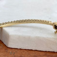 Estate 10KT yellow gold prong-set diamond bangle bracelet. A beautiful, staple diamond bangle! Also available in white gold. Push-in clasp with safety latch Measures: 2.3mm width at widest point 7” length Shown on a 6" wrist SI/I clarity, I-J color 1.00 carat lab-created diamonds Stamped 10KT and hallmarked Weight: 9.60 grams Stackable Diamond Bracelet For Anniversary, Modern Yellow Gold Tennis Bracelet With Prong Setting, Classic Yellow Gold Cuff Bracelet With Single Cut Diamonds, Anniversary Diamond Bangle Bracelet With Prong Setting, Anniversary Yellow Gold Cuff Bracelet With Diamond Accents, Anniversary Yellow Gold Diamond Bracelet With Prong Setting, Modern Gold Diamond Bracelet With Prong Setting, 14k Gold Prong-set Tennis Bangle Bracelet, 14k Gold Prong Set Tennis Bangle Bracelet