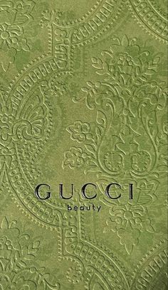 gucci's green brocaded fabric with the word, beauty on it