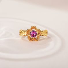 The fashion ring features a sparkling center stone with sculpted petals of a flower, and meaningful engravings inside the band. Give her this masterpiece as a gift to make her feel loved, cared for and pampered.Weight: 3.5 gHeight: 10.25 mmMaterial: 925 SilverPlating Color: Yellow Gold Elegant Flower-shaped Diamond Cut Rings, Formal Pink Flower-shaped Rings, Fine Jewelry Birthstone Flower Promise Ring, Flower Shaped Promise Ring With Birthstone, Luxury Flower Shaped Ring For Wedding, Luxury Flower Wedding Ring, Luxury Flower-shaped Rings With Center Stone, Elegant Yellow Gold Flower Promise Ring, Fine Jewelry Flower-shaped Birthstone Promise Ring