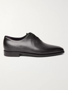 No man's wardrobe should be without a pair of black Oxfords, they're the smartest option for business meetings and more formal occasions. Expertly constructed by artisans in Italy, Berluti 's version is made from the brand's Venezia leather that's been treated by hand to give it a slight shine and unique patina. They come with wooden shoe trees so you can keep them in tip-top condition. Shown here with TOM FORD shirt, Ermenegildo Zegna suit, Kingsman tie. Designer Dress Shoes With Goodyear Welt For Business, Designer Semi-formal Dress Shoes With Goodyear Welted, Luxury Goodyear Welted Dress Shoes For Formal Occasions, Luxury Business Dress Shoes With Goodyear Welt, Black Leather Sole Dress Shoes For Business Meetings, Black Dress Shoes With Leather Sole For Business Meetings, Elegant Brogue Detailed Dress Shoes For Business, Elegant Brogue Dress Shoes For Business Meetings, Elegant Wingtip Dress Shoes For Business Meetings