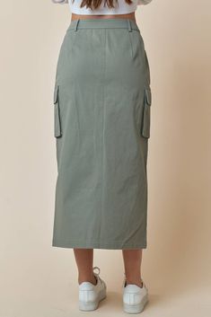 This stylish Cargo Utility Skirt is a great addition to your casual wardrobe. Featuring belt loops, a zip-fly and a button closure, and handy utility pockets, you'll be ready to take on any adventure! All in the comfort of 100% cotton. What are you waiting for? Suit up! Utility Cotton Cargo Skirt, Utility Denim Skirt With Cargo Pockets, Utility Cargo Skirt With Pockets For Work, Utility Cotton Skirt With Pockets, Utility Skirt With Multiple Pockets For Work, Utility Cotton Skirt With Side Pockets, Cotton Utility Skirt With Side Pockets, Utility Style Cotton Cargo Skirt With Pockets, Utility Cotton Cargo Skirt With Pockets