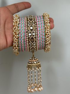 pearl kundan   bangles set for both hands. Pink Bangle For Festivals, Festive Pink Bracelets With Gota Work, Festive Pink Bracelet With Gota Work, Pink Bollywood Bangle For Festivals, Festive Pink Bangle With Gota Work, Pink Meenakari Wedding Bracelets, Pink Bangle With Gota Work For Diwali, Pink Bollywood Bracelets For Festivals, Pink Meenakari Bracelets For Festivals