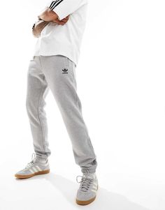 Sweatpants by adidas Originals Your airport uniform Inner drawstring waistband Functional pockets adidas logo embroidery Elastic cuffs Slim, tapered fit Adidas Athleisure Sweatpants With Pockets, Adidas Sweatpants For Streetwear, Adidas Sportswear Sweatpants For Streetwear, Adidas Casual Sweatpants With Elastic Side Panels, Adidas Relaxed Fit Sweatpants Sportswear, Men Loungewear, Winter Party Dress, Long Sleeve Floral Dress, Sweaters And Leggings