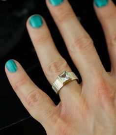 Part of my Forest Floor series, this bold ring evokes cold, crisp days and the smell of wood and leaves.

Elements of the natural world are deconstructed and conveyed in lines, texture, and color; the finished product features a clean and clear white topaz, secured by a 14K yellow gold bezel and presented on a hand-textured, sterling silver band.

IMPORTANT: This is a ready-to-ship piece—NOT made to order—available in size 7.25 only.

Not your size? Most rings can be easily resized by a reputable jeweler.

A customizable version of this ring is available here: Black Or White Square Fallen Branches Modern Open Topaz Ring, Modern White Topaz Ring For Anniversary, Lines Texture, Neutral Jewelry, Wedding Pendant, Bold Rings, Forest Floor, Eco Friendly Jewelry, White Square