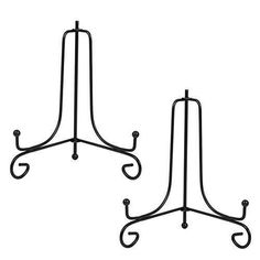 two wrought iron plant stands on white background