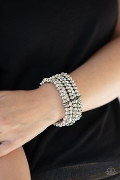 Held together with a sleek silver fitting, edgy rows of faceted silver beads and glittery white rhinestones are threaded along with stretchy bands around the wrist, creating glamorous layers. Sold as one individual bracelet. Paparazzi Accessories Jewelry, Infinity Wrap, Bracelet Set Silver, Coil Bracelet, Nickel Free Jewelry, White Bracelets, Paparazzi Accessories, Dainty Bracelets, White Rhinestone