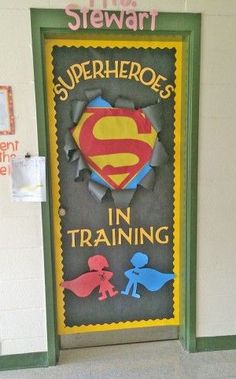 this is a classroom door decorated to look like a superman movie poster with the words, superheros in training