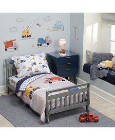 a child's bedroom with blue walls and furniture