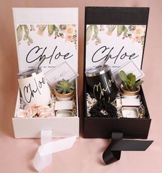 two gift boxes with coffee and succulents in them on a pink background