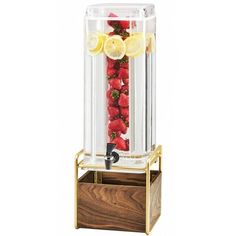 a fruit machine with strawberries and lemons in it's display case on a wooden stand