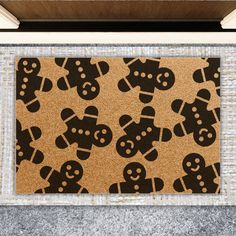 a door mat with gingerbreads on it