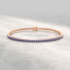 Elevate your style with this exquisite 3.14-carat natural blue sapphire tennis bracelet, meticulously crafted in lustrous 14K/18K yellow gold. Each shimmering sapphire is artfully set, creating a mesmerizing ombre effect that transitions seamlessly from lighter to darker hues. Perfect for celebrating September birthdays, this bracelet makes a timeless Birthday gift. Its timeless design and exceptional craftsmanship ensure it will become a cherished heirloom for generations to come. 𝐅𝐞𝐚𝐭𝐮𝐫? Sapphire Tennis Bracelet, Stacked Wedding Rings, Engagement Rings Oval, Natural Blue Sapphire, Natural Sapphire, White Sapphire, Tennis Bracelet, Eternity Bands, Bracelet Sizes