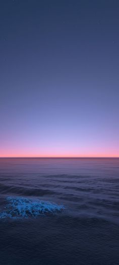 the sun is setting over the ocean as it reflects in the water's surface