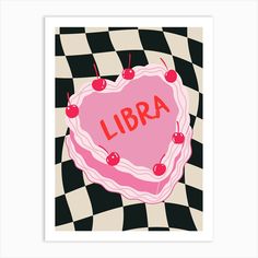 a pink heart shaped cake with cherries on it and the word libra written in red