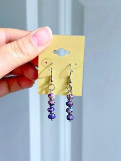 Elevate your accessory game with these stunning deep purple sea sediment jasper dangle earrings! Designed with care and crafted with high-quality surgical stainless steel, these dainty earrings are the perfect addition to any jewelry collection. The unique combination of the rich purple jasper and sleek stainless steel creates a trendsetting look that is both elegant and versatile.  Dangle Length: 1.25in  Metal: Surgical Stainless Steel which is the safer option for people with nickel allergies Everyday Purple Dangle Earrings, Purple Jasper, Purple Sea, Nickel Allergy, Rich Purple, Dainty Earrings, Deep Purple, Handmade Earrings, Earrings Handmade