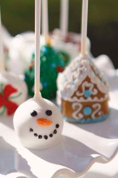 some cake pops with frosting and decorations on them