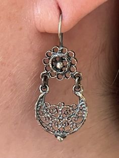 We are excited to feature a collection of Mexican Silver Filigree Earrings from Oaxaca in our store. Each piece is crafted from molten silver, processed and formed into intricate designs, often adorned with exquisite stones. Our artisans, with their skilled hands, create unique pieces that encapsulate a stunning and romantic aesthetic. Adorning these pieces, you're not just wearing jewelry; you're embodying a special, timeless elegance. Materials:  Oxidized Pure 92.5 Sterling Silver Gemstone: Malachite Drop Length: 1 1/2" long, 3/4" wide Closure: Ear Wire Elegant Sterling Silver Chandelier Earrings For Festival, Ornate Oval Pierced Earrings, Artisan Oxidized Dangle Earrings, Artisan Dangle Earrings With Oxidized Finish, Bohemian Teardrop Oxidized Earrings, Traditional Sterling Silver Teardrop Chandelier Earrings, Traditional Teardrop Sterling Silver Chandelier Earrings, Traditional Oval Filigree Earrings, Artisan Teardrop Chandelier Earrings As Gift