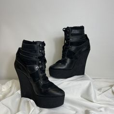 Burberry Fur Lined Combat Wedge Heel (Lace Ups)- Black (Leather). Includes Duster Feature Zip Off Top Sizing: 38 (Sizing Guide Included), 7.5 Inch Heel Condition: Used- Wear On Heels (Pictured), Fading Leather. Please View All Images For Condition Before Purchasing Tags: Emo, Punk, Winter, Goth, Street Ldk Leather High-top Heels For Winter, Trendy Leather Platform Boots With Wedge Heel, Edgy Leather Wedge Boots With Platform, Edgy High Ankle Leather Wedge Boots, Leather High Heel Wedge Boots, Leather Platform Boots With Wedge Heel For Parties, Edgy Leather Boots With Wedge Heel, Chic Leather Platform Wedge Boots, Edgy Leather Wedge Boots For Party