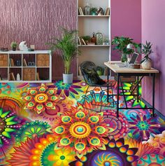 a room with an artistic floor design painted on the floor and colorful flowers in the center