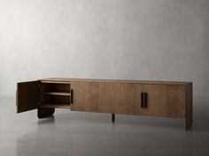 the sideboard is made from wood and has an open door on one side, and two shelves on the other